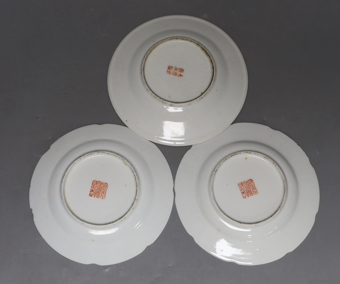 A pair late 19th century Chinese enamelled porcelain plates, and another similar, 15.5cm